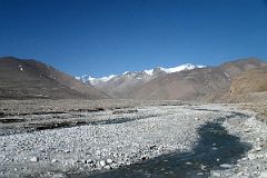 12 Crossing The Rongbuk River With Cho Oyu Ahead After Descending From the Pass From Tingri Just Before Joinging The Road To Mount Everest North Face Base Camp In Tibet.jpg